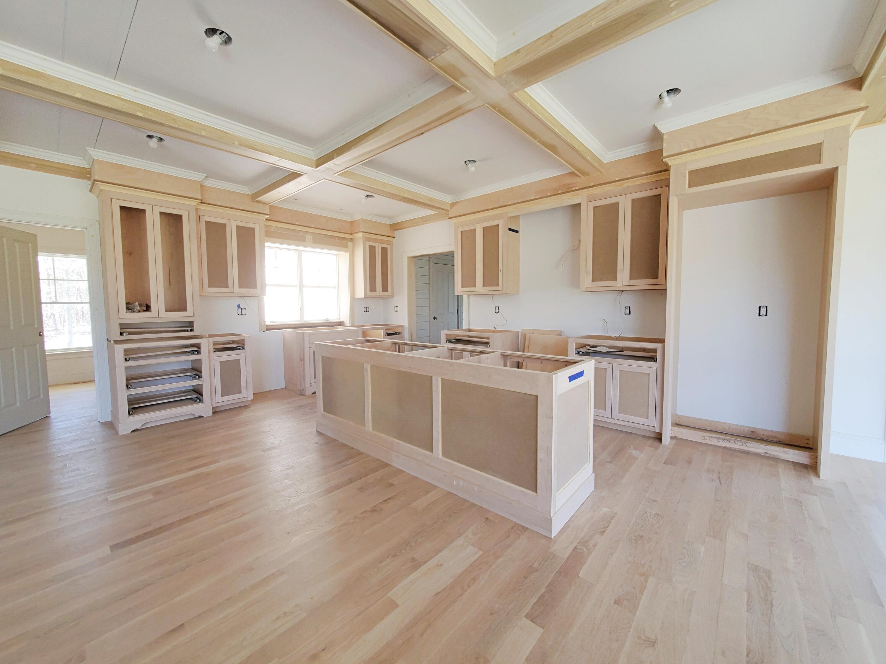 3 Snow Way Orleans, MA 02653 - Photo 18 of 33 a kitchen with stainless steel appliances granite countertop a stove top oven a sink and white cabinets with wooden floor
