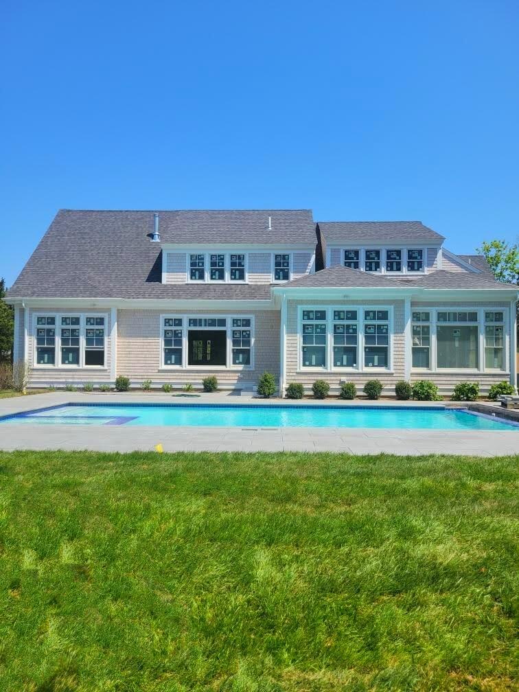3 Snow Way Orleans, MA 02653 - Photo 27 of 33 a front view of a house with a garden