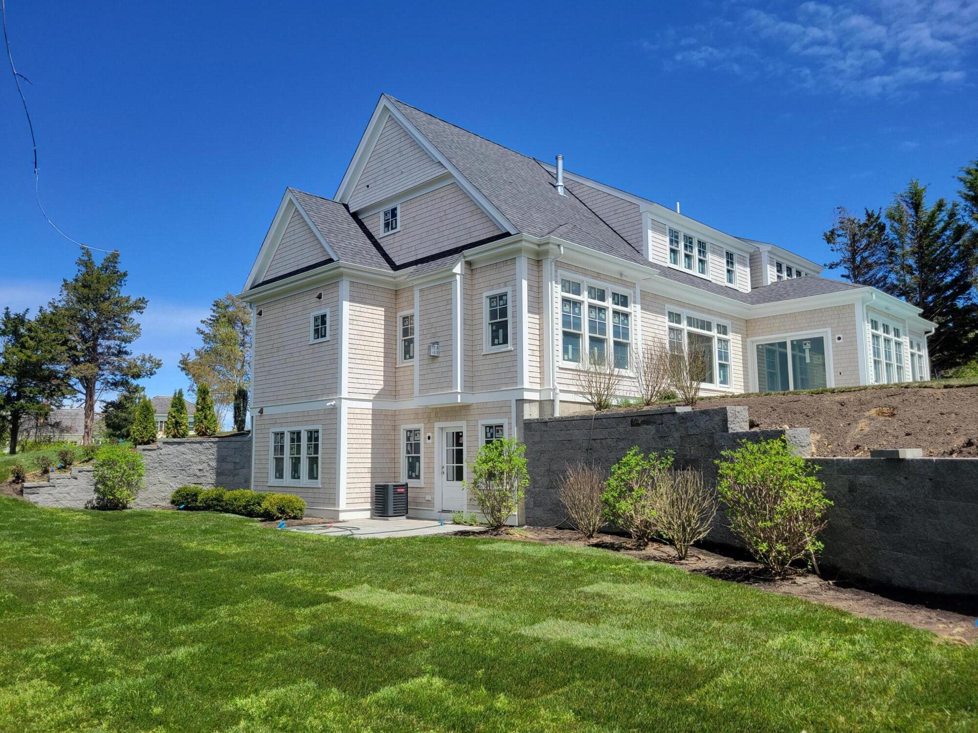 3 Snow Way Orleans, MA 02653 - Photo 6 of 33 a view of a big house with a big yard and potted plants