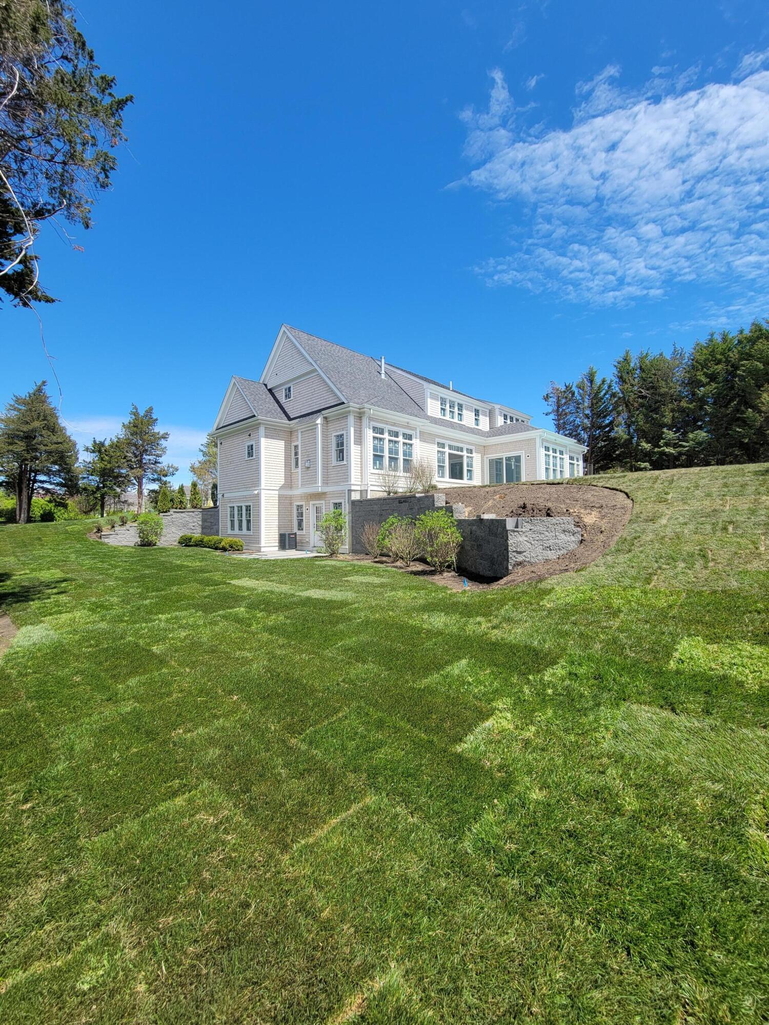 3 Snow Way Orleans, MA 02653 - Photo 7 of 33 a front view of a house with a garden and yard