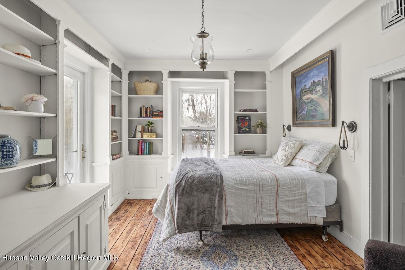 33 Broad Street Kinderhook, NY 12106 - Photo 31 of 83 33 - Balcony Bedroom surrounded by Books