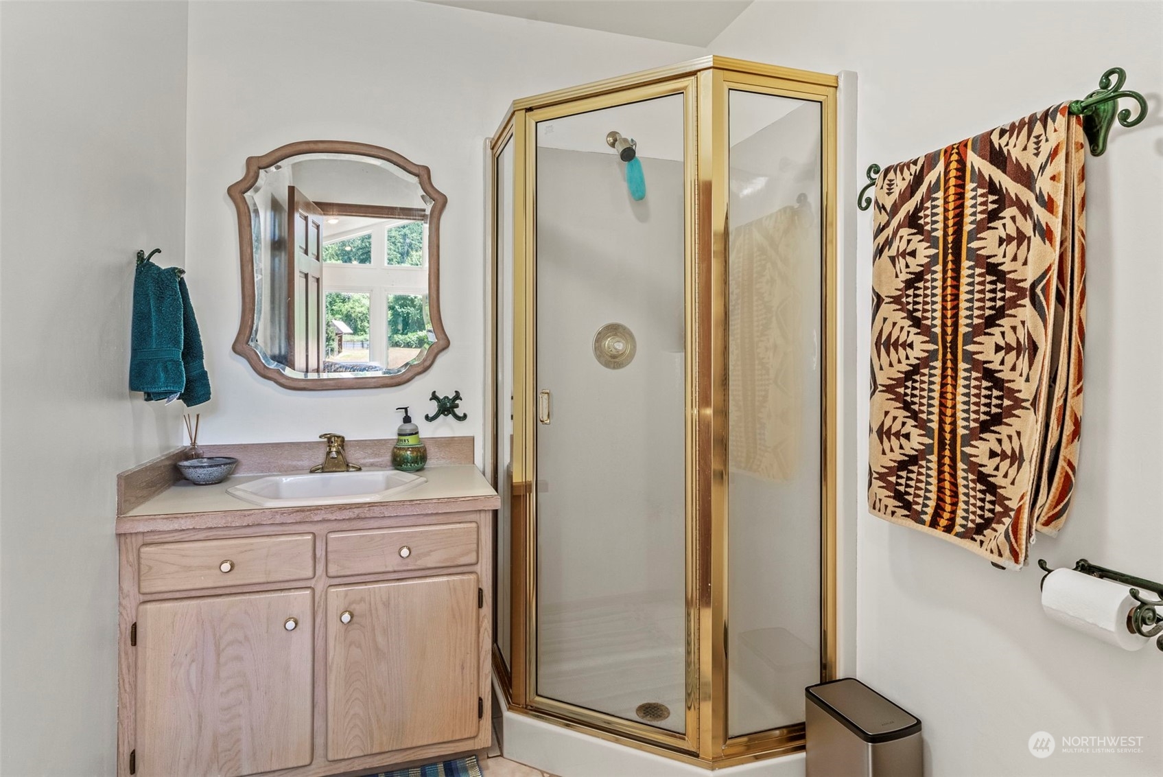 397 Deep Creek Road Chehalis, WA 98532 - Photo 15 of 34 a bathroom with a granite countertop sink a mirror a vanity and a shower