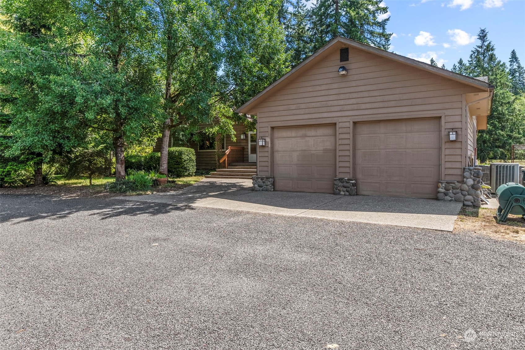 397 Deep Creek Road Chehalis, WA 98532 - Photo 2 of 34 a front view of a house with a yard and garage