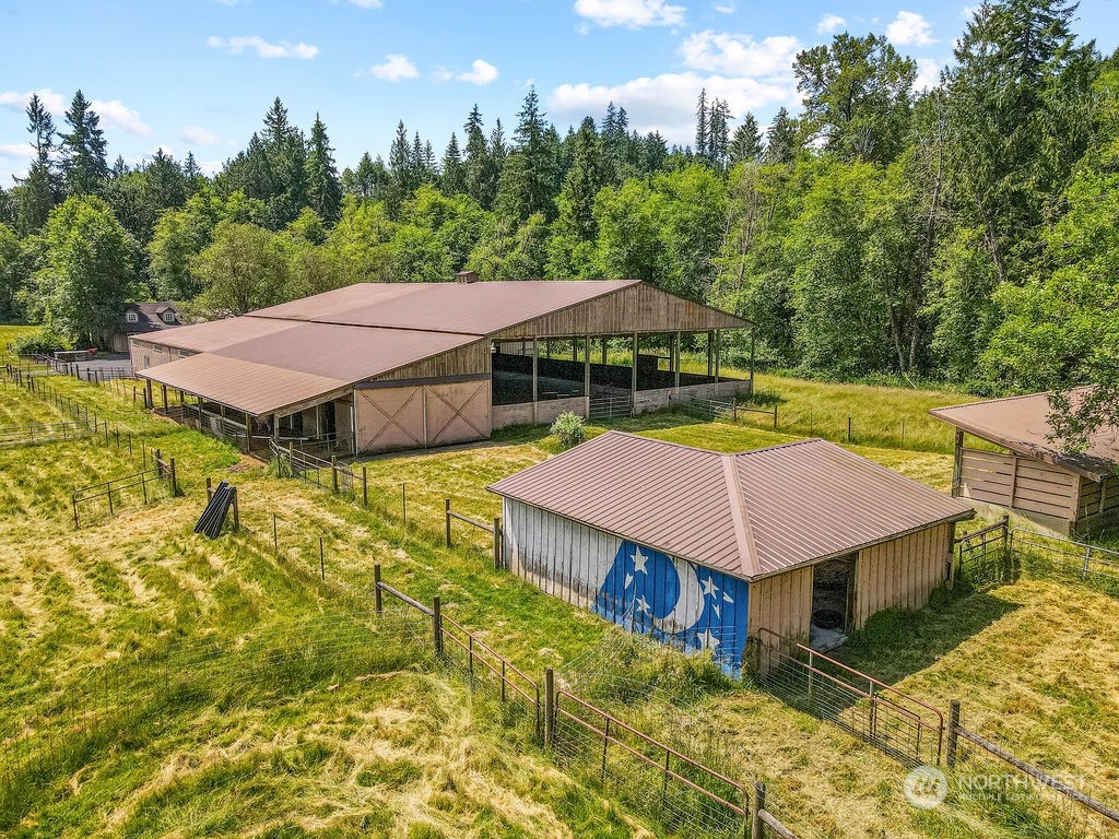 397 Deep Creek Road Chehalis, WA 98532 - Photo 28 of 34 a aerial view of a house with swimming pool and lawn chairs under an umbrella