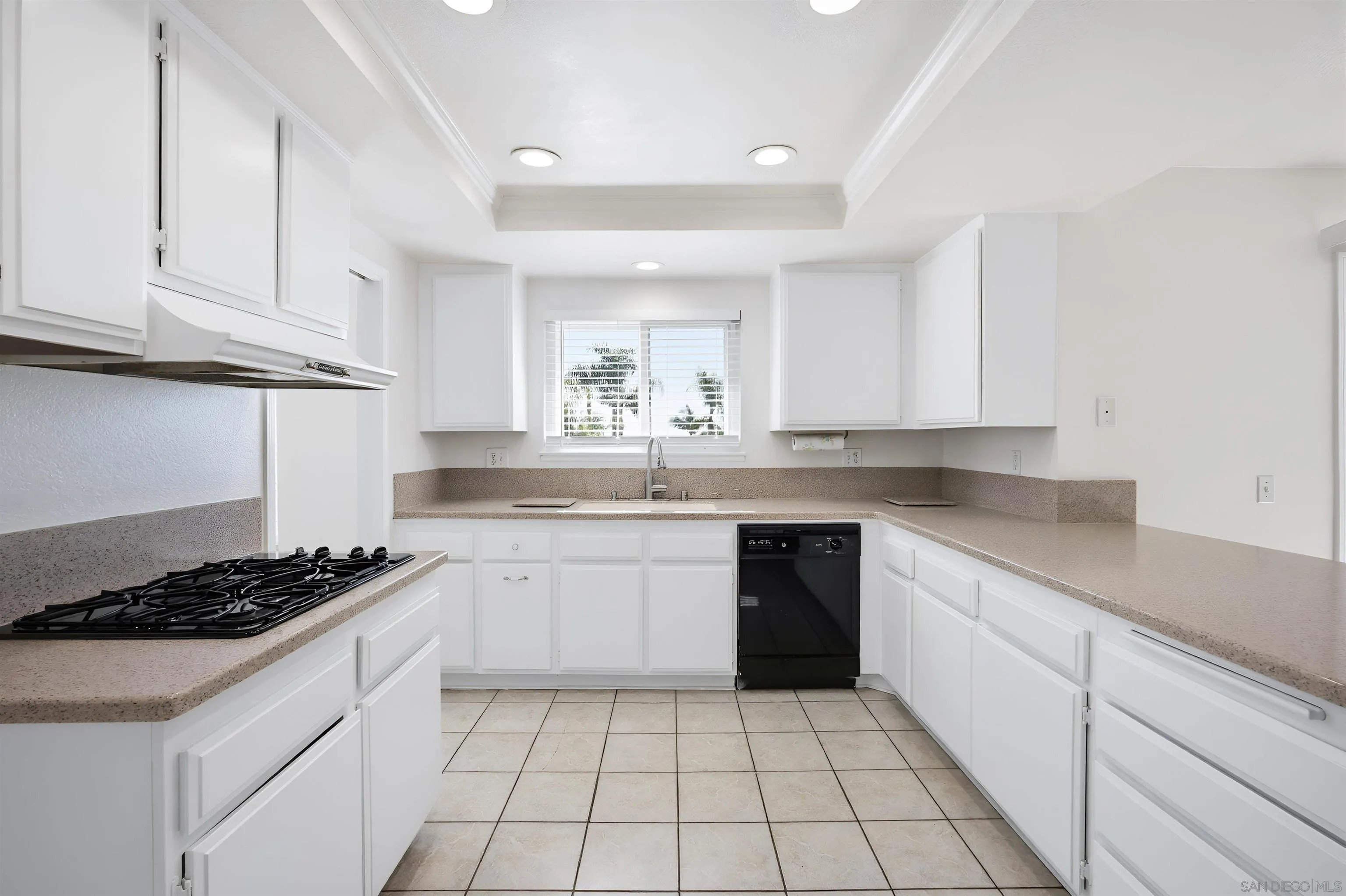 10365 Hidden Farm Road Rancho Cucamonga, CA 91737 - Photo 13 of 55 a kitchen with a sink stove and cabinets
