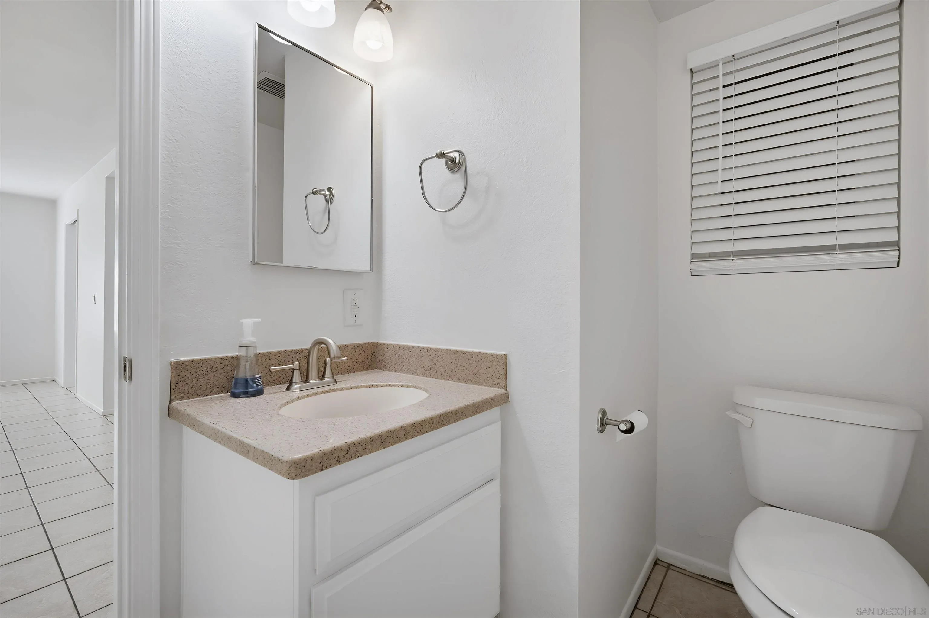 10365 Hidden Farm Road Rancho Cucamonga, CA 91737 - Photo 22 of 55 a bathroom with a toilet sink and mirror
