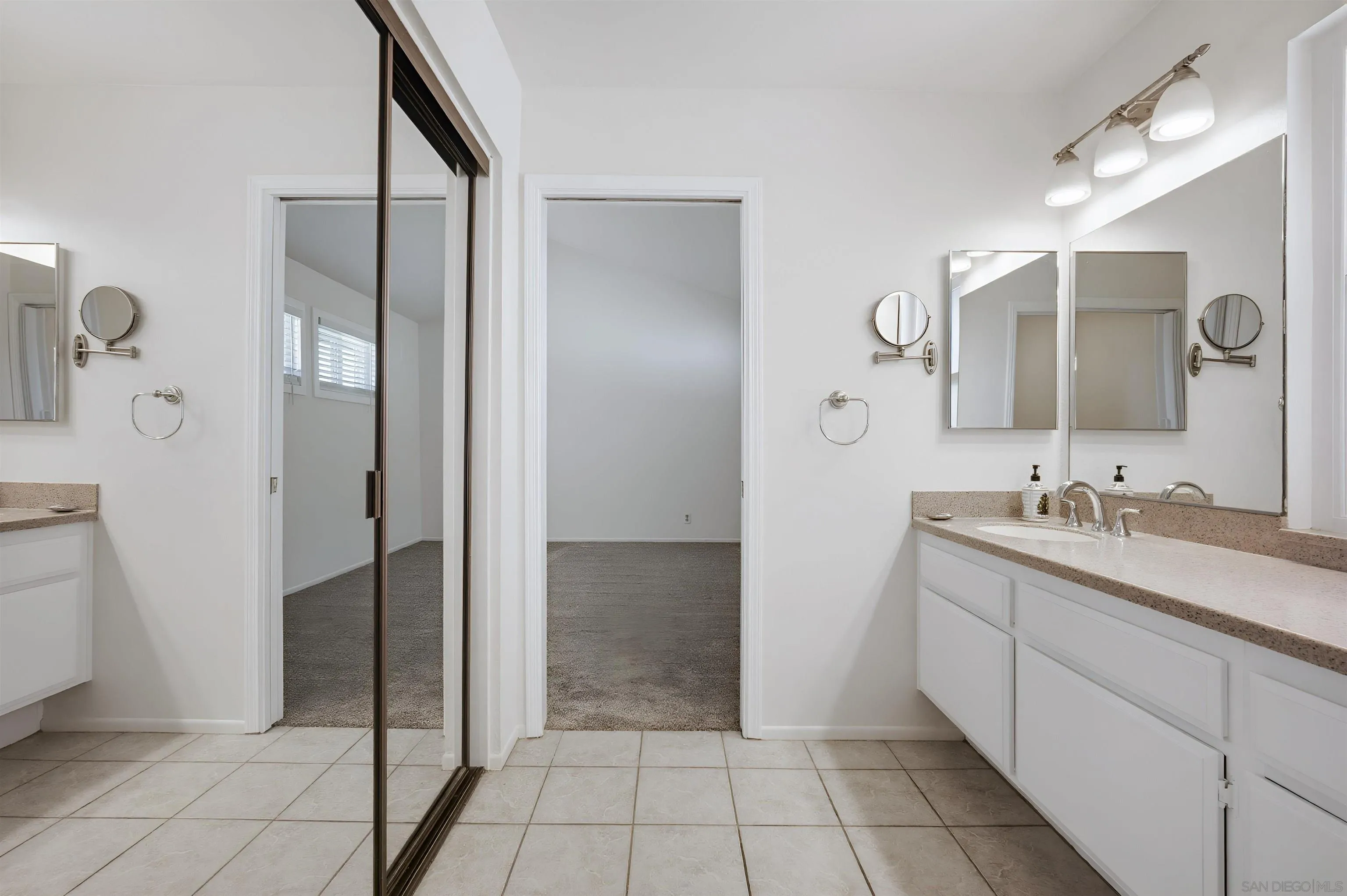 10365 Hidden Farm Road Rancho Cucamonga, CA 91737 - Photo 37 of 55 a bathroom with a double vanity sink and mirror