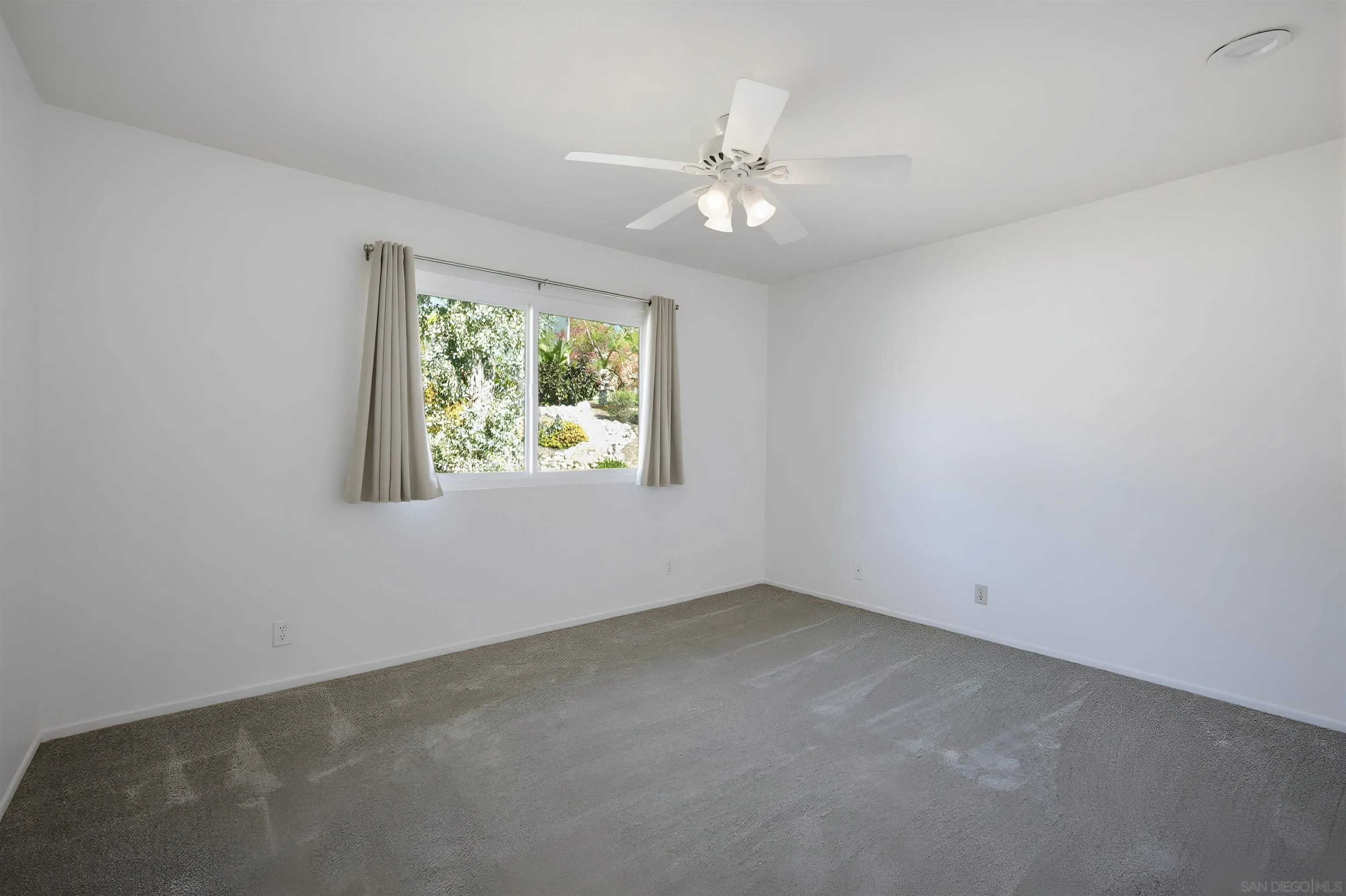 10365 Hidden Farm Road Rancho Cucamonga, CA 91737 - Photo 43 of 55 an empty room with windows and fan