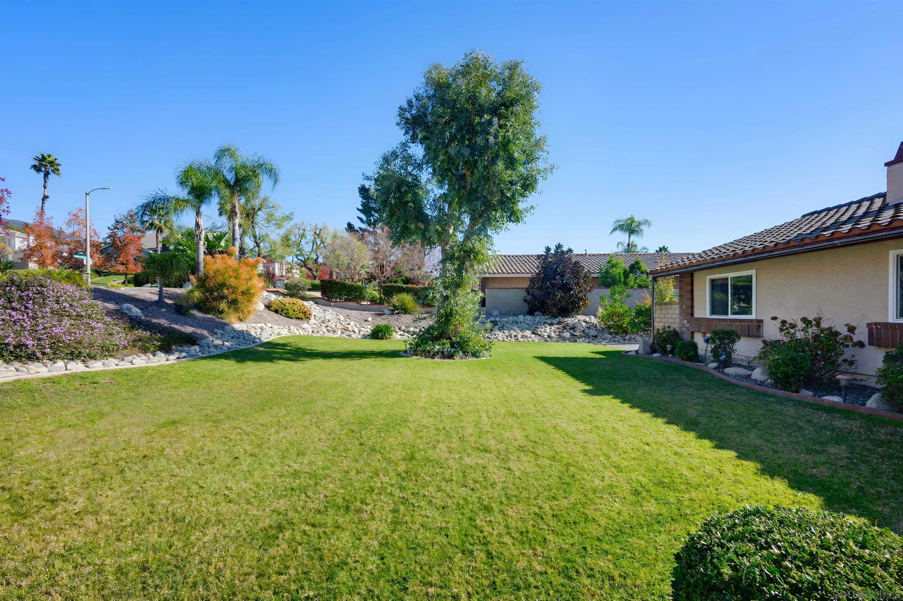 10365 Hidden Farm Road Rancho Cucamonga, CA 91737 - Photo 53 of 55 a view of backyard of house with outdoor seating and green space