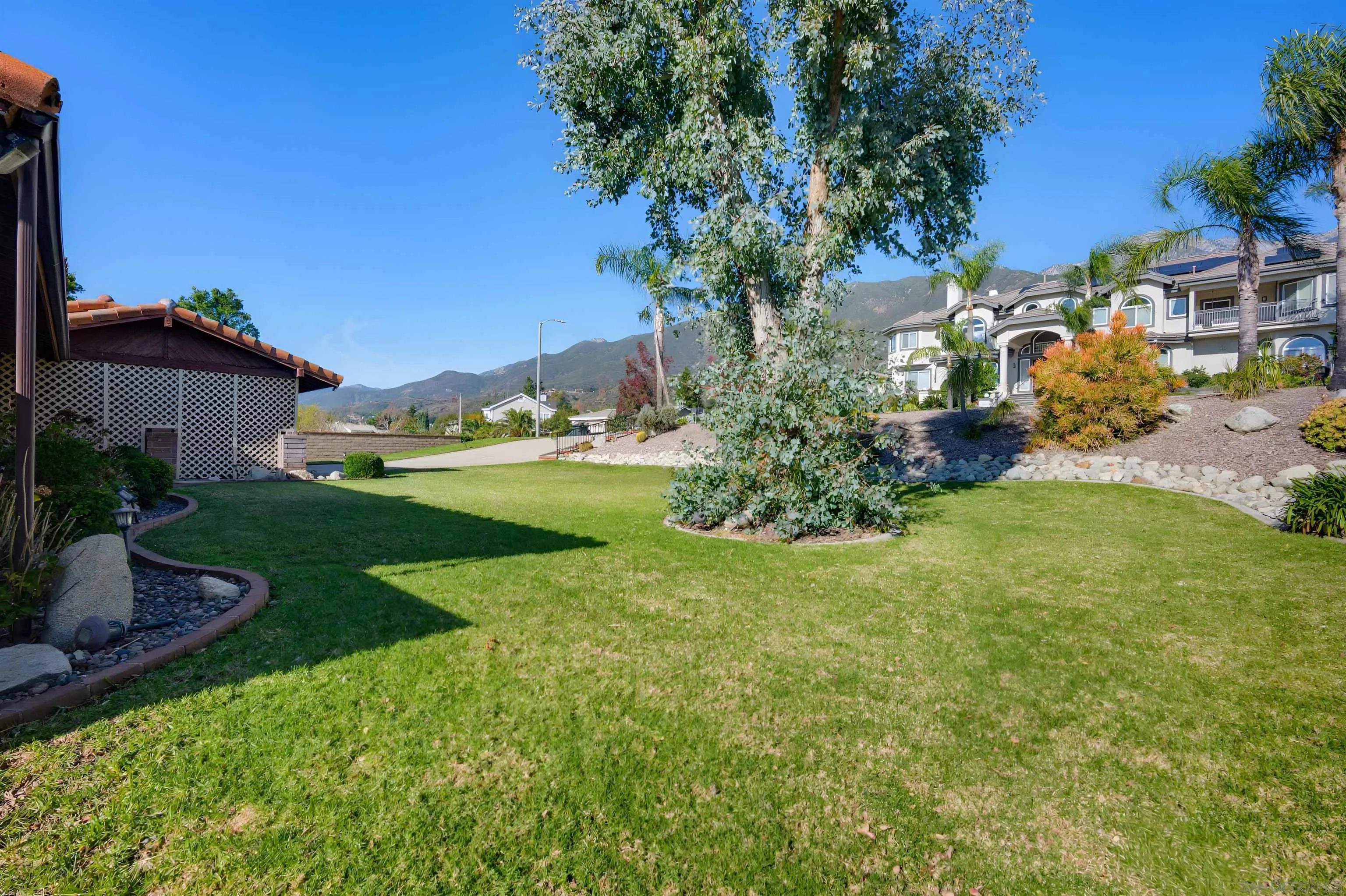 10365 Hidden Farm Road Rancho Cucamonga, CA 91737 - Photo 55 of 55 a view of a garden with a building in the background