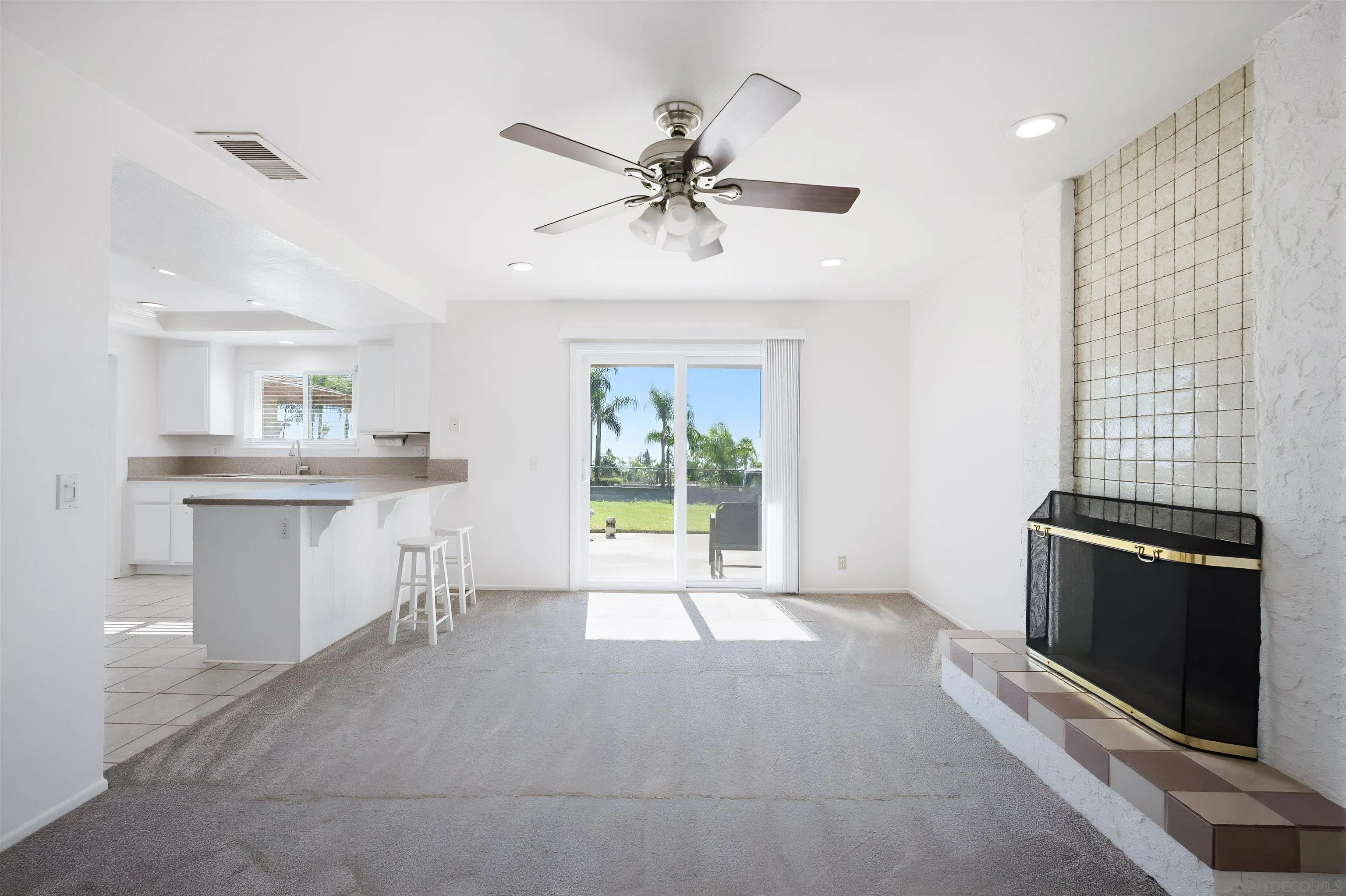 10365 Hidden Farm Road Rancho Cucamonga, CA 91737 - Photo 8 of 55 a view of a kitchen with a sink a ceiling fan and windows