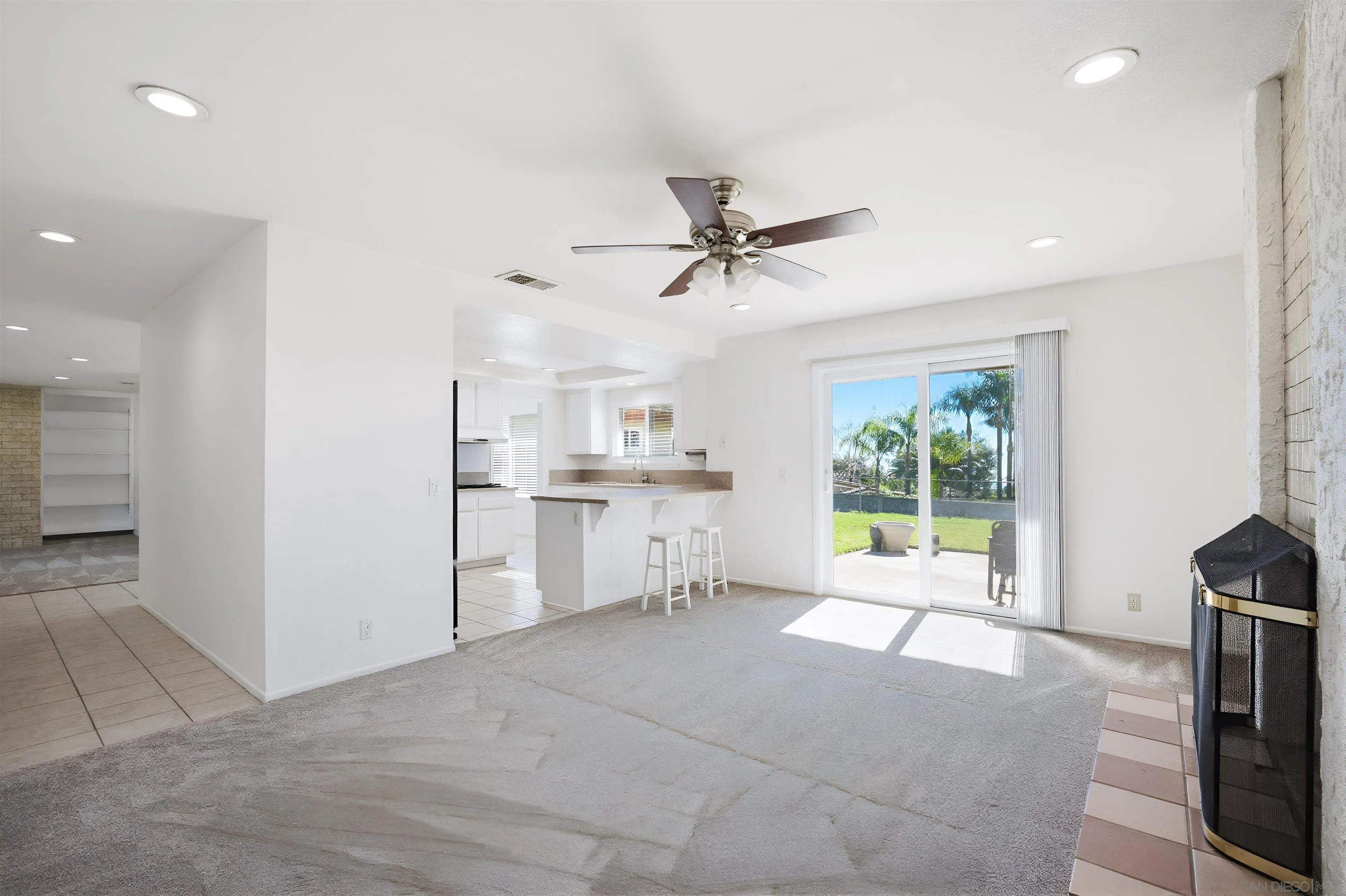 10365 Hidden Farm Road Rancho Cucamonga, CA 91737 - Photo 9 of 55 a view of a kitchen with furniture and a ceiling fan