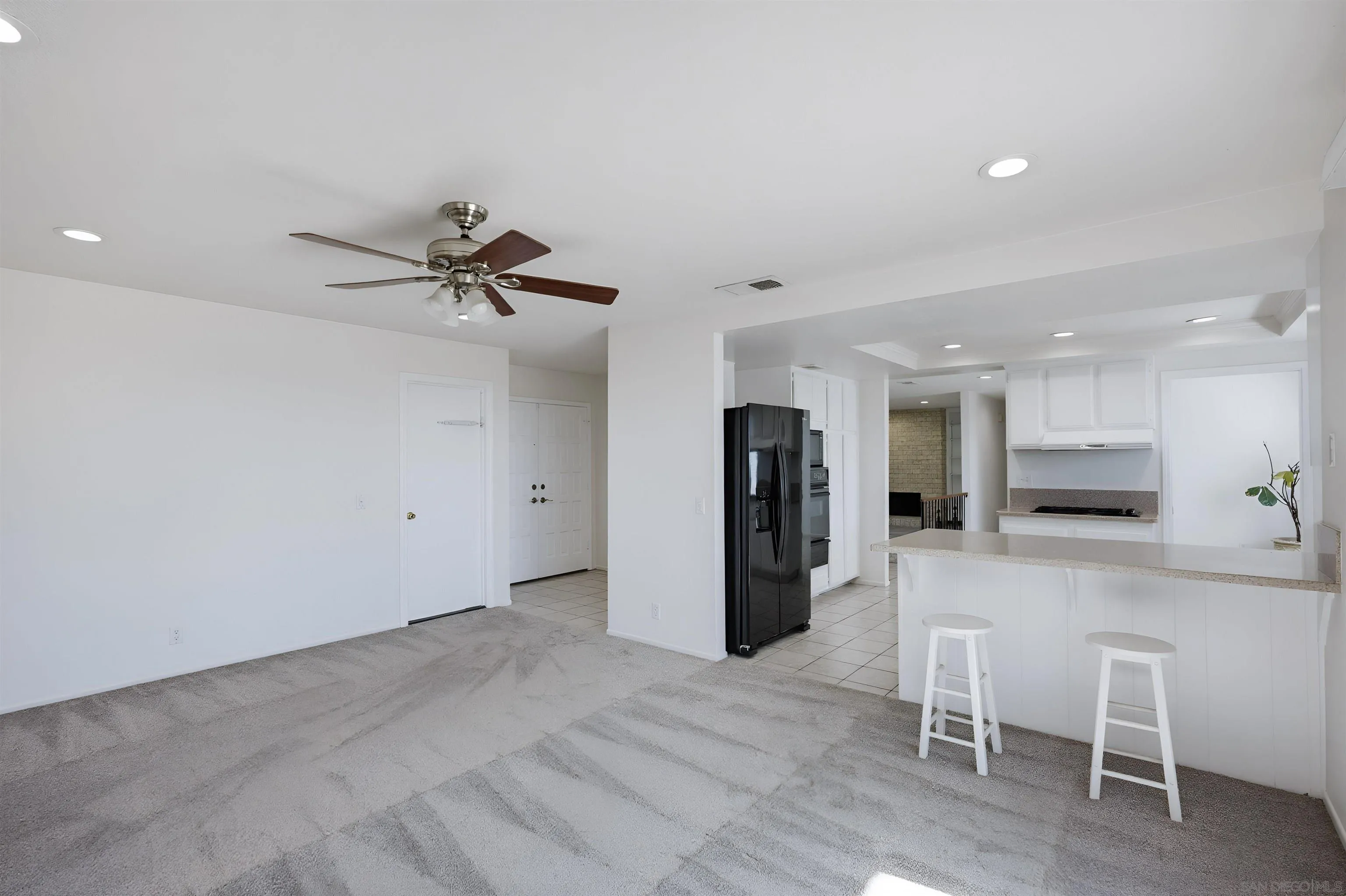 10365 Hidden Farm Road Rancho Cucamonga, CA 91737 - Photo 10 of 55 a view of kitchen with refrigerator stove and wooden floor