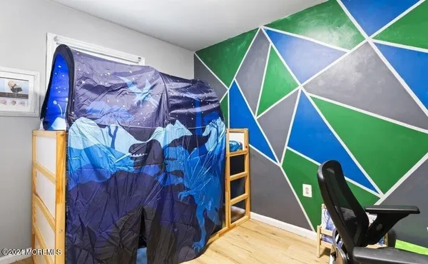 a view of an entryway with wooden floor