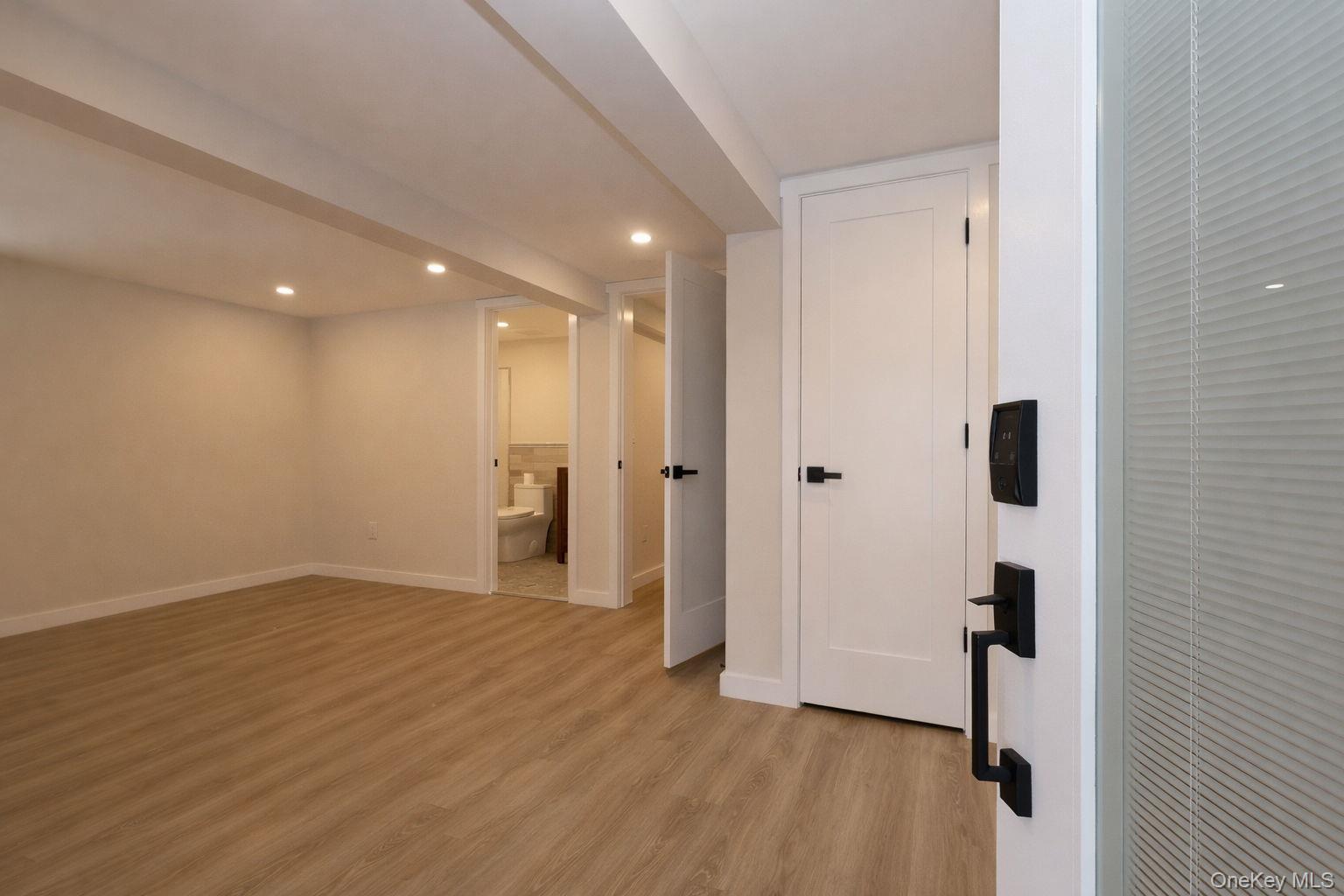 52 Roe Avenue Highland Falls, NY 10928 - Photo 19 of 22 Large finished basement room with bathroom and door leading to outside.