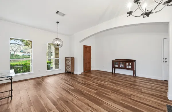 a kitchen with stainless steel appliances granite countertop sink stove top oven and cabinets