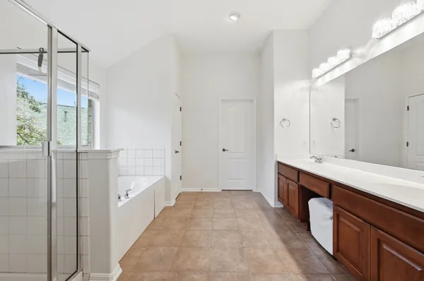 a bathroom with a bathtub and a shower