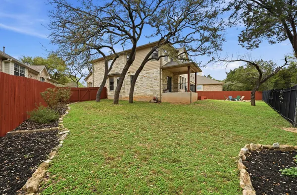 a view of a backyard with sitting area