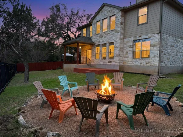 a view of a chairs and table in the patio