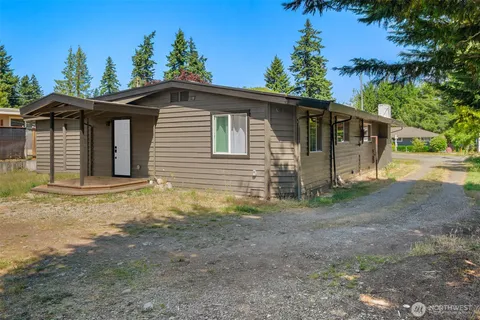 a house with trees in the background