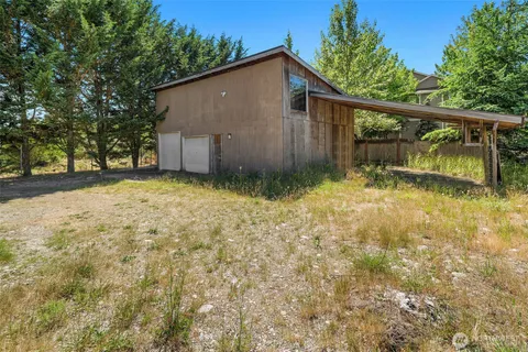 a backyard of a house with lots of green space