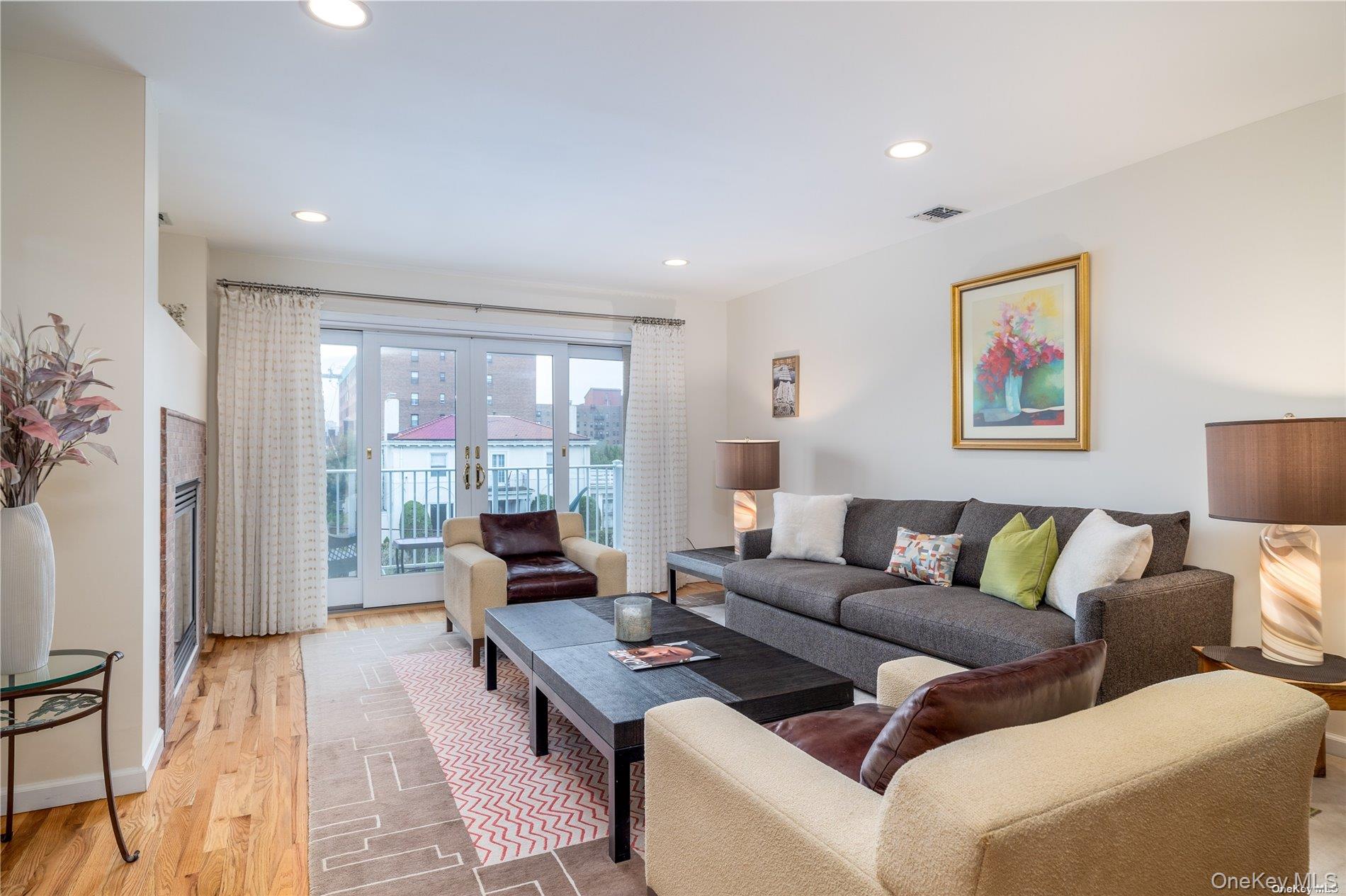 159 Monroe Boulevard, Unit UPPR Long Beach, NY 11561 - Photo 5 of 24 a living room with furniture and a large window