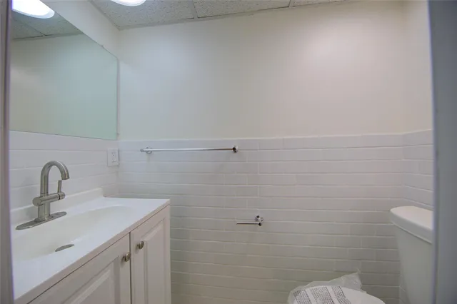 a bathroom with a sink and mirror