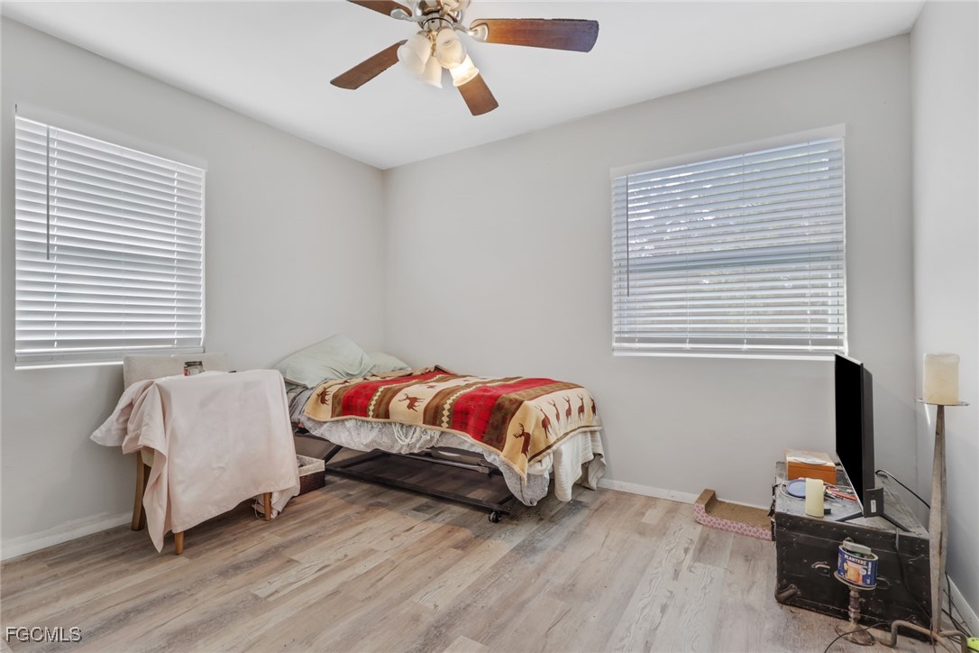 1506 Rena Avenue South Lehigh Acres, FL 33976 - Photo 15 of 39 a bedroom with a bed and a window