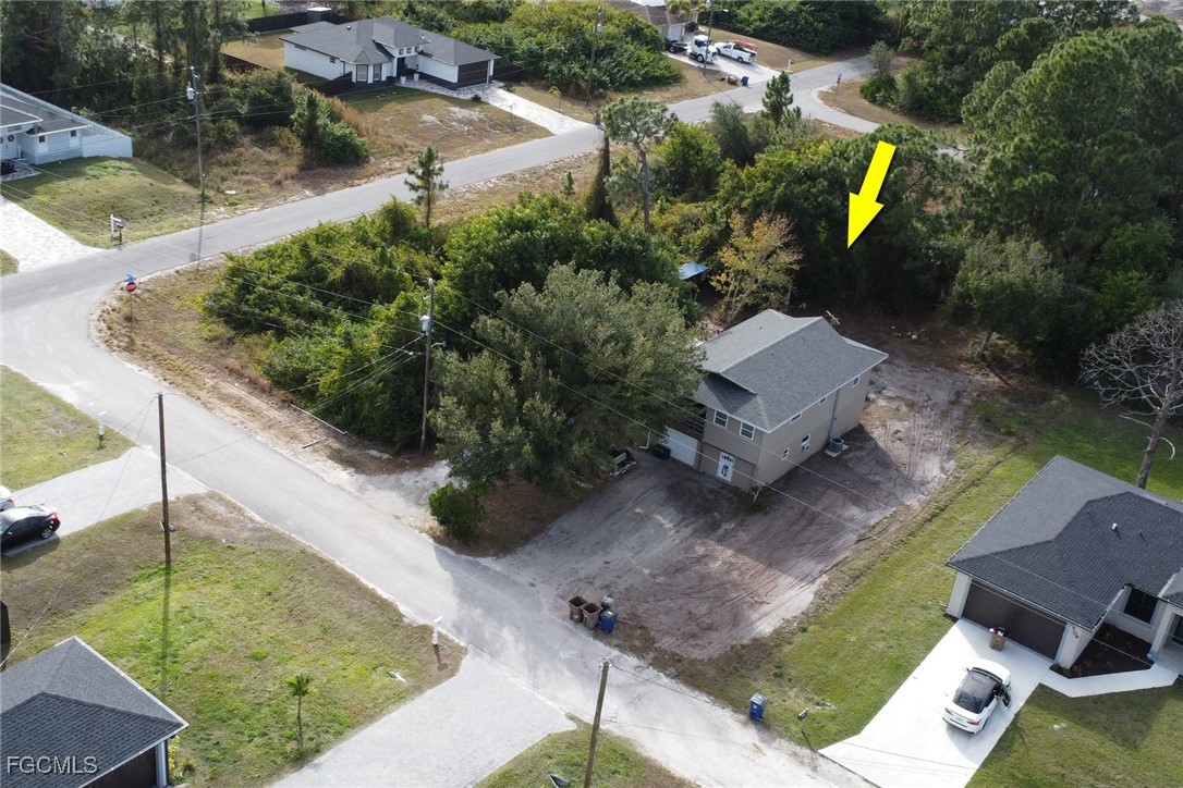 1506 Rena Avenue South Lehigh Acres, FL 33976 - Photo 29 of 39 an aerial view of a house with garden space and street view