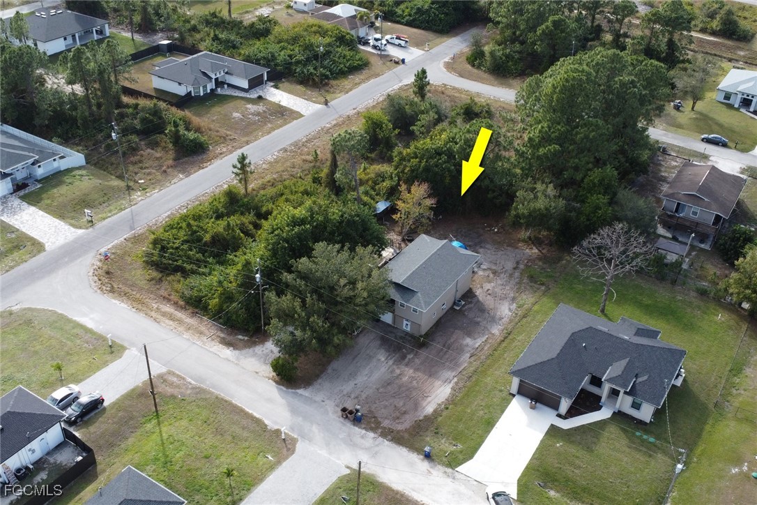 1506 Rena Avenue South Lehigh Acres, FL 33976 - Photo 30 of 39 an aerial view of a house with a swimming pool