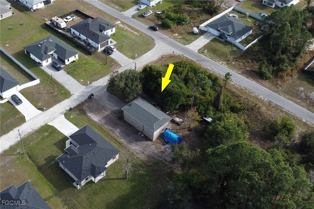 1506 Rena Avenue South Lehigh Acres, FL 33976 - Photo 32 of 39 an aerial view of house with a yard