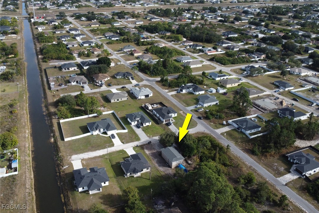 1506 Rena Avenue South Lehigh Acres, FL 33976 - Photo 33 of 39 an aerial view of residential houses with outdoor space