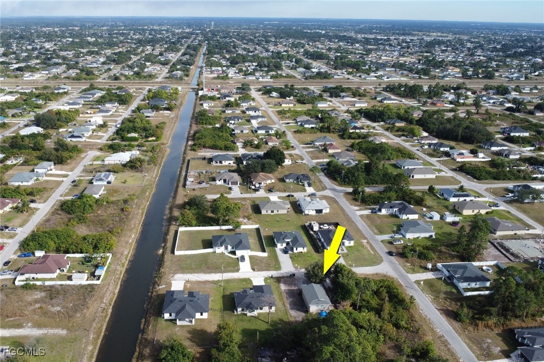 1506 Rena Avenue South Lehigh Acres, FL 33976 - Photo 35 of 39 an aerial view of residential houses with outdoor space