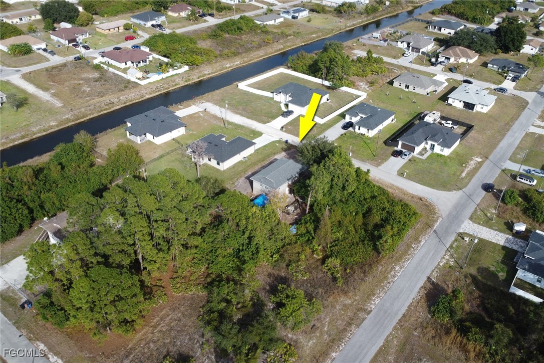 1506 Rena Avenue South Lehigh Acres, FL 33976 - Photo 38 of 39 an aerial view of a residential houses with yard