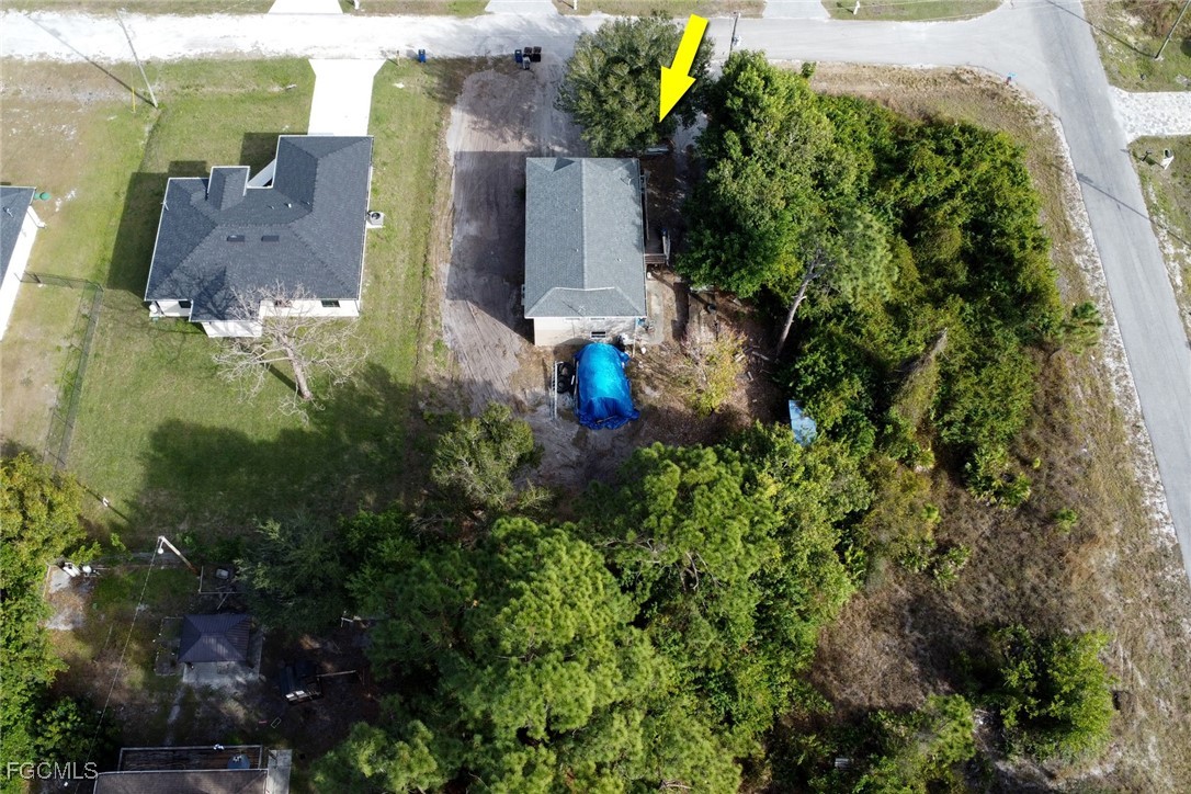 1506 Rena Avenue South Lehigh Acres, FL 33976 - Photo 39 of 39 an aerial view of a house with outdoor space and street view