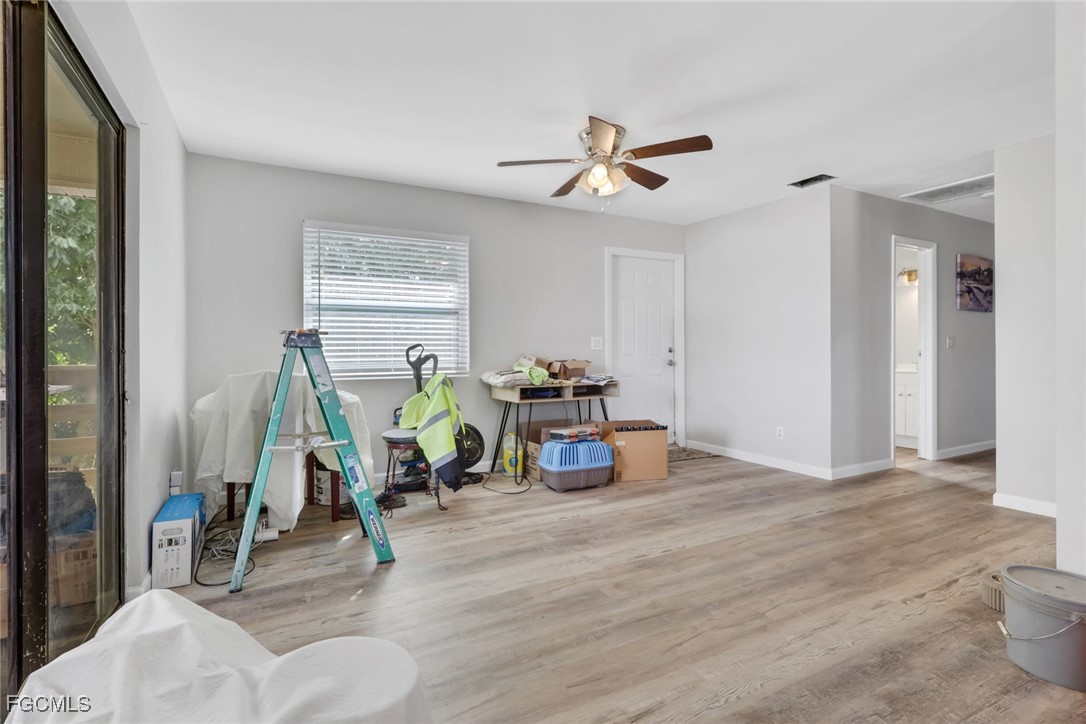 1506 Rena Avenue South Lehigh Acres, FL 33976 - Photo 7 of 39 a view of a room with gym equipment