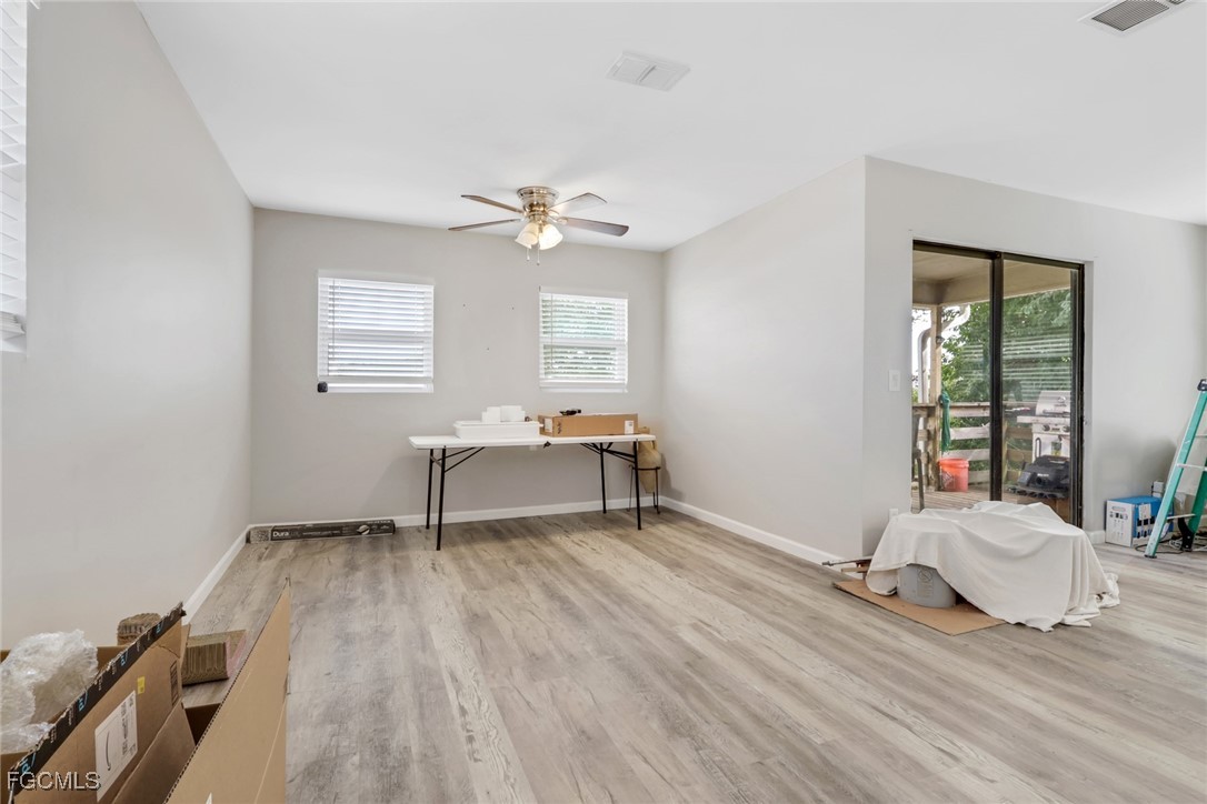 1506 Rena Avenue South Lehigh Acres, FL 33976 - Photo 9 of 39 a bedroom with a bed and a window