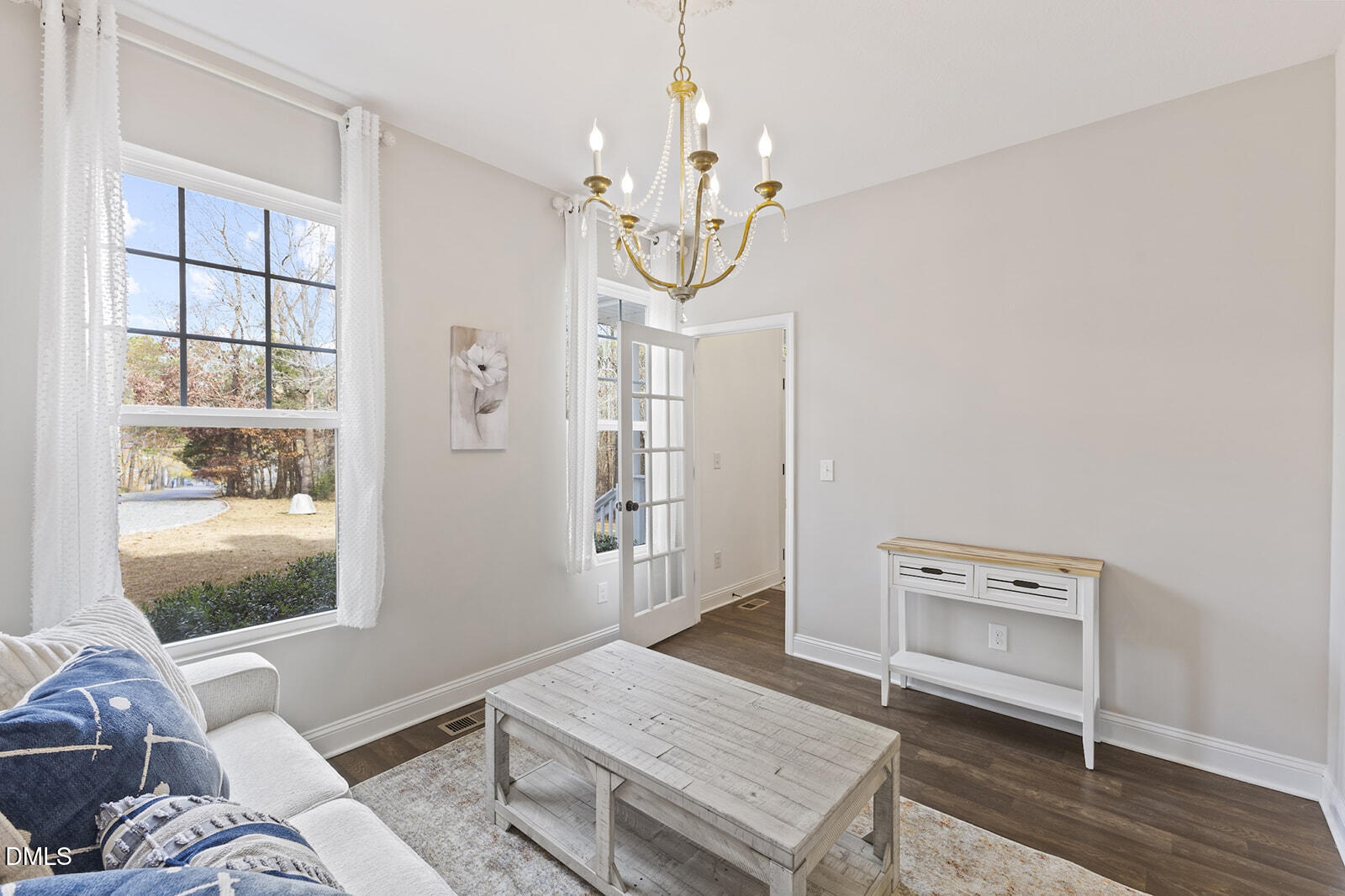 1021 Coley Road Raleigh, NC 27613 - Photo 15 of 42 a living room with furniture and wooden floor