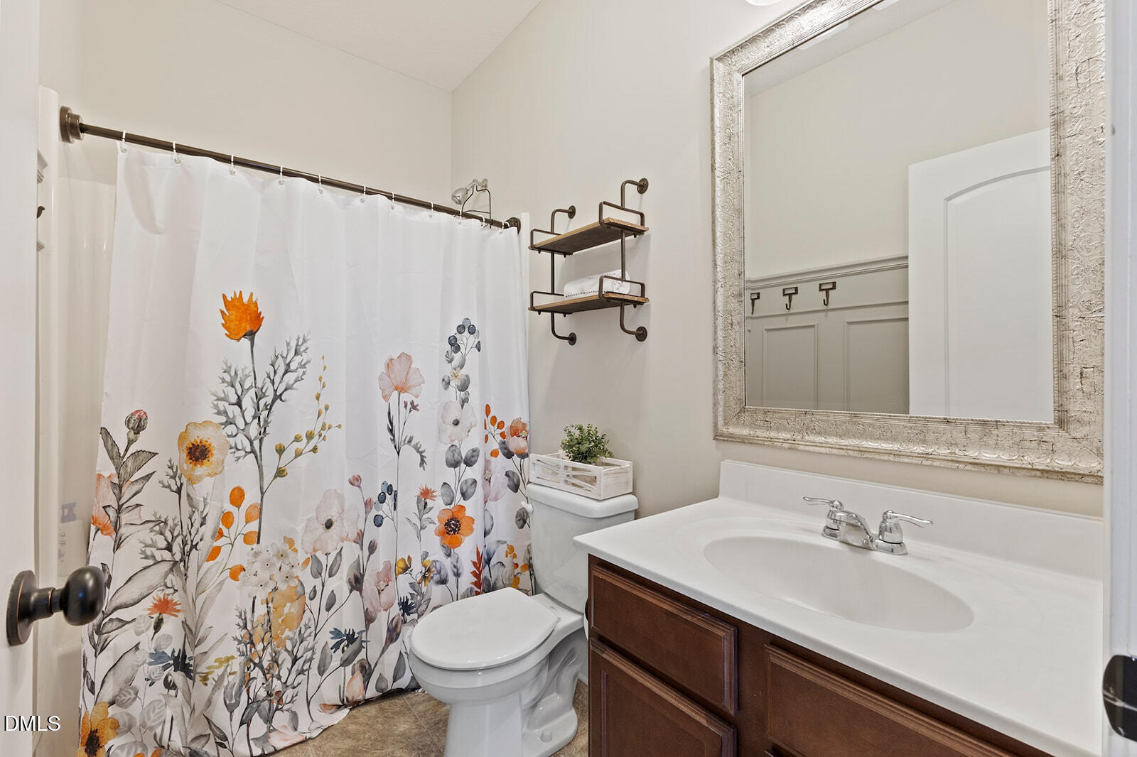 1021 Coley Road Raleigh, NC 27613 - Photo 18 of 42 a bathroom with a sink and a mirror