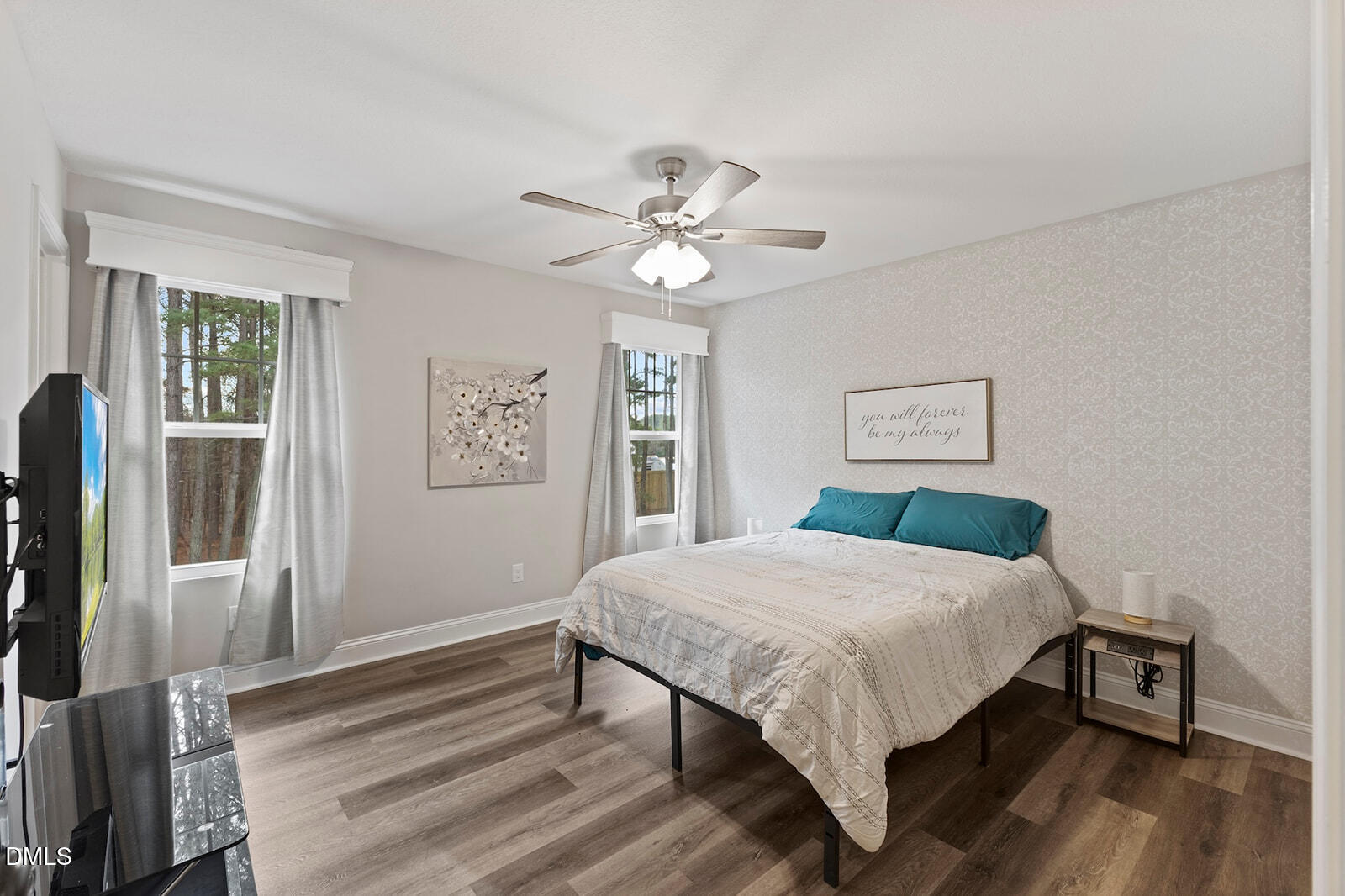 1021 Coley Road Raleigh, NC 27613 - Photo 23 of 42 a bed sitting in a bedroom next to a window