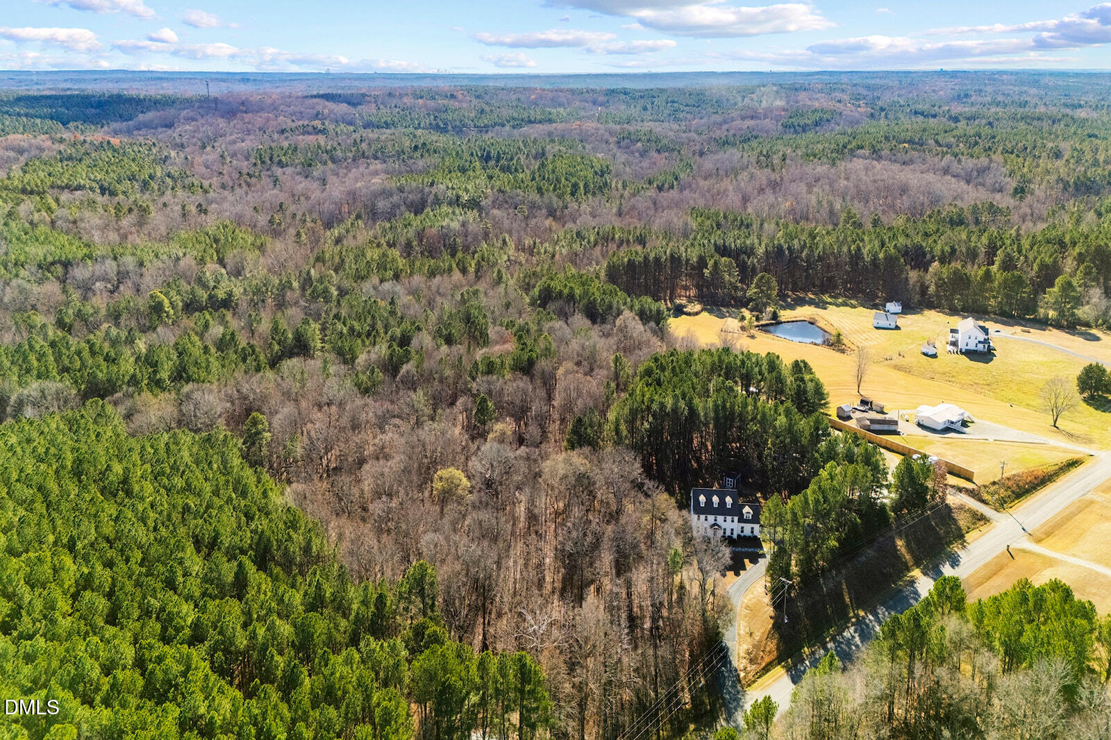 1021 Coley Road Raleigh, NC 27613 - Photo 40 of 42 a view of a lake with a yard