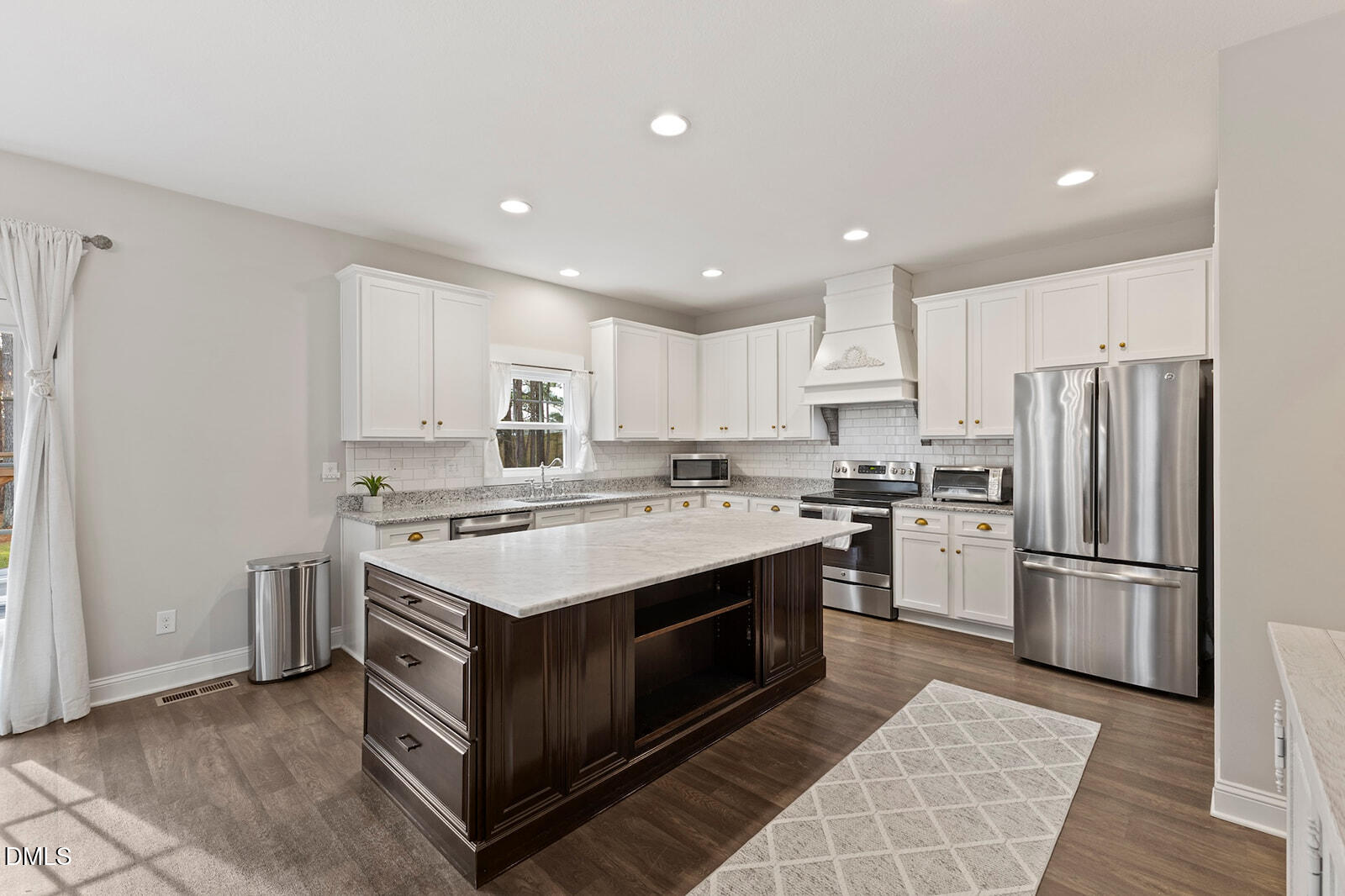 1021 Coley Road Raleigh, NC 27613 - Photo 4 of 42 a kitchen with a stove sink and refrigerator