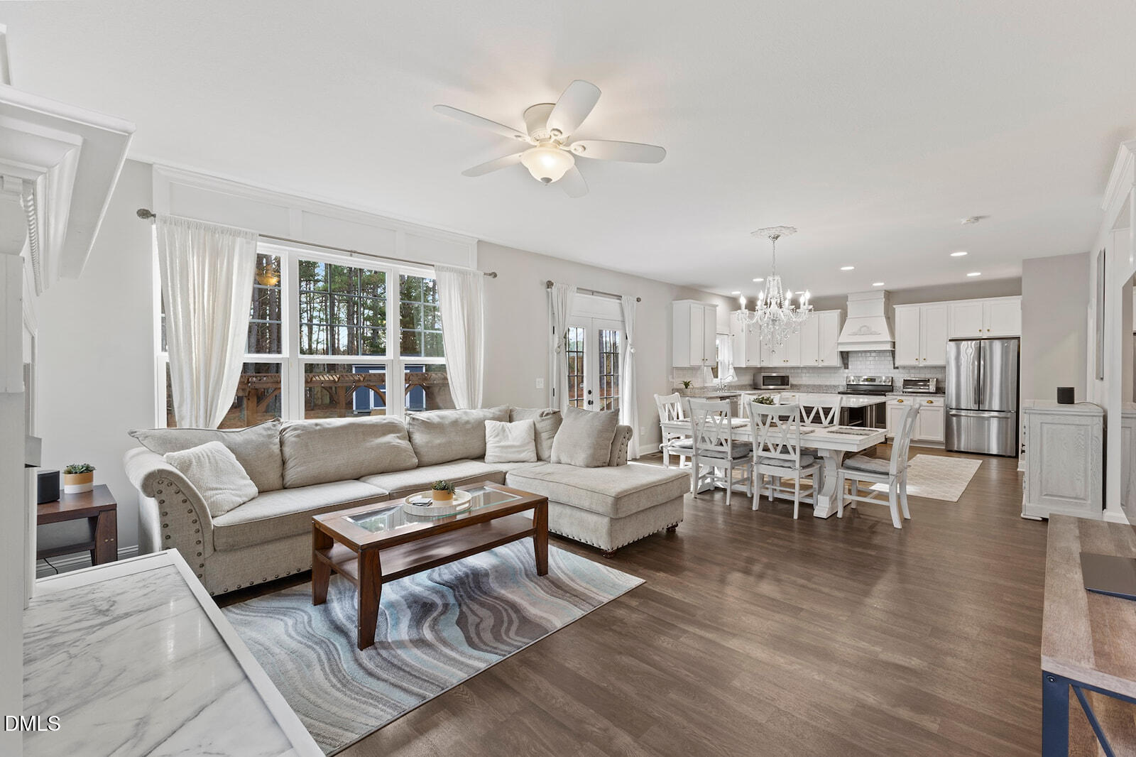 1021 Coley Road Raleigh, NC 27613 - Photo 9 of 42 a living room with furniture kitchen view and a large window