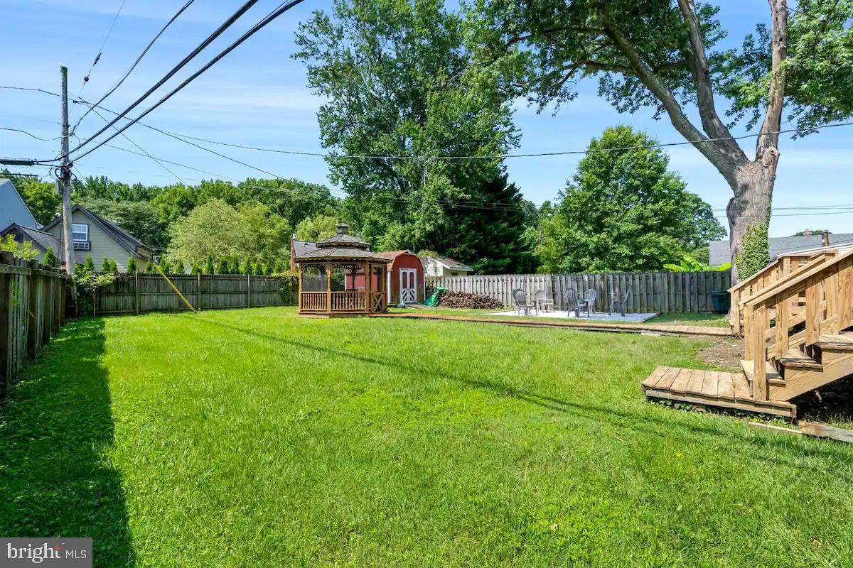 301 Beverley Place Edgewater, MD 21037 - Photo 4 of 44 a view of a house with backyard and a slide