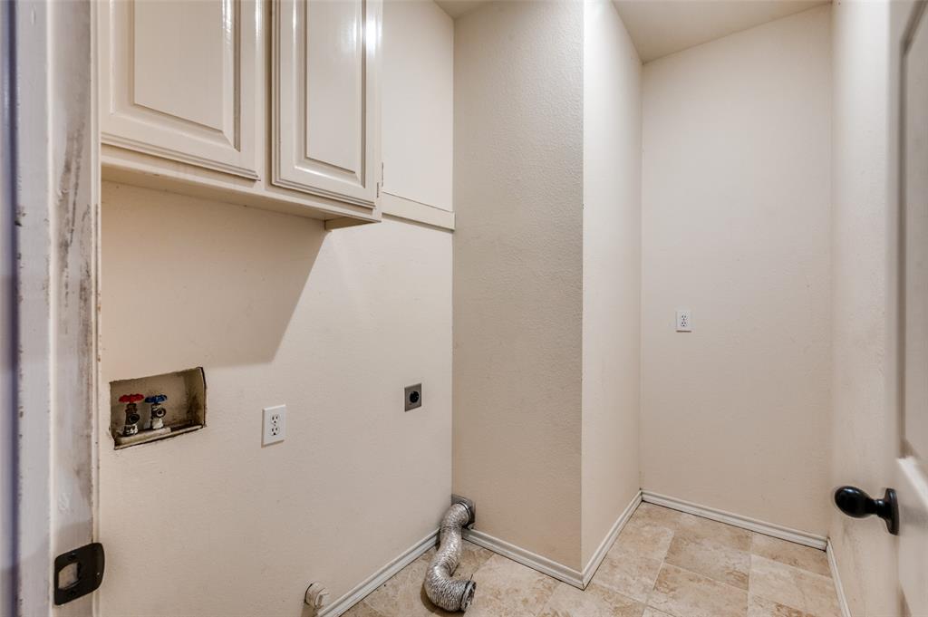 3902 Amy Court Arlington, TX 76016 - Photo 23 of 26 Laundry room between the kitchen and the garage entrance