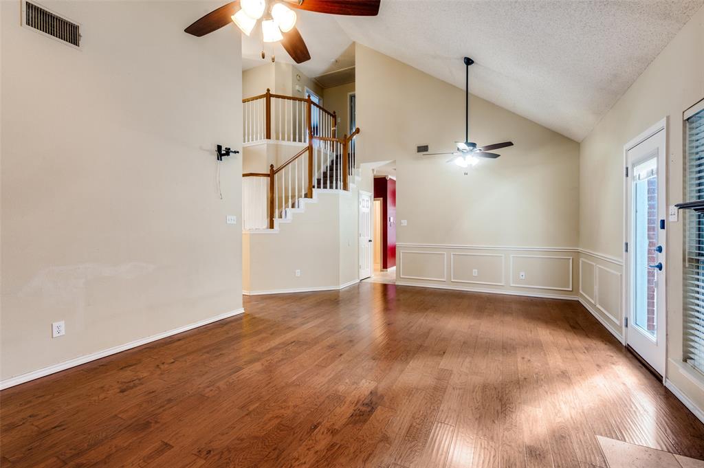 3902 Amy Court Arlington, TX 76016 - Photo 4 of 26 Living room looking towards the dining area. The backyard is through the door on the right.