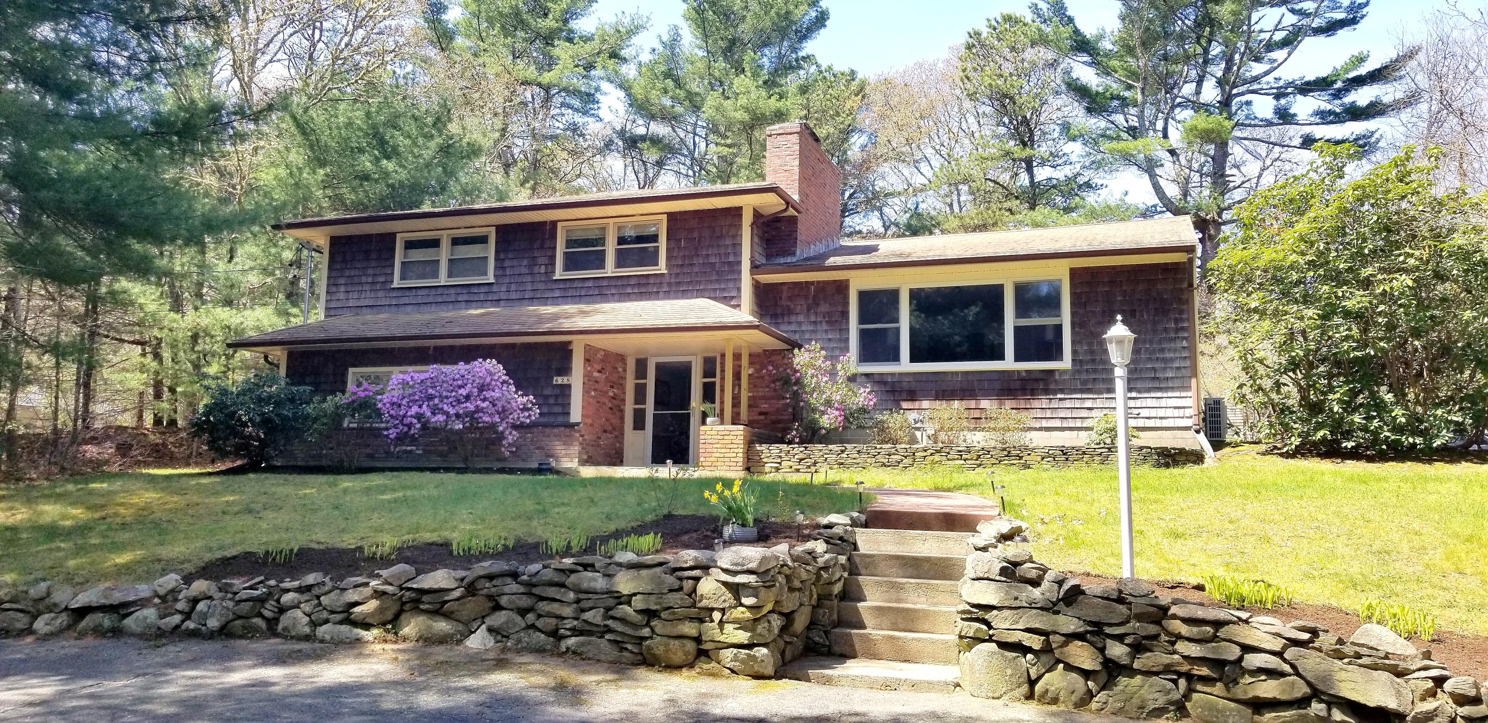 628 County Road Pocasset, MA 02559 - Photo 1 of 21 a view of a house with backyard and sitting area