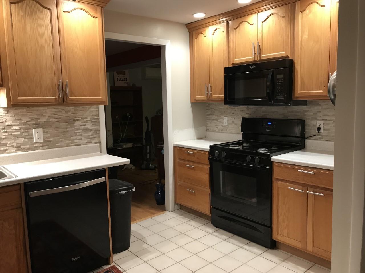 628 County Road Pocasset, MA 02559 - Photo 3 of 21 a kitchen with a stove and a microwave