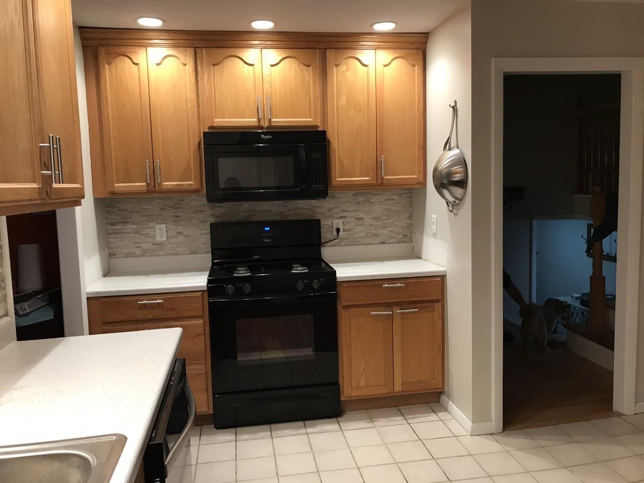 628 County Road Pocasset, MA 02559 - Photo 5 of 21 a kitchen with a refrigerator and a stove