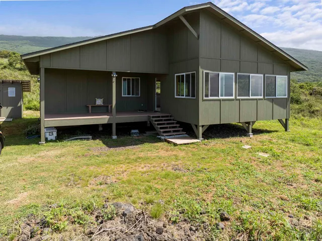 a house view with a garden space